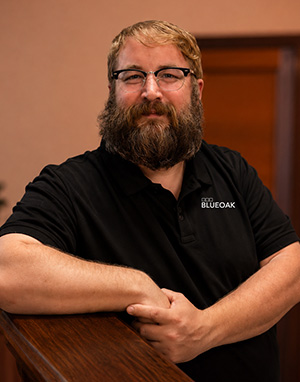 Man with beard wearing BlueOak polo shirt