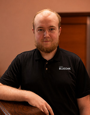 Man with beard wearing BlueOak polo shirt